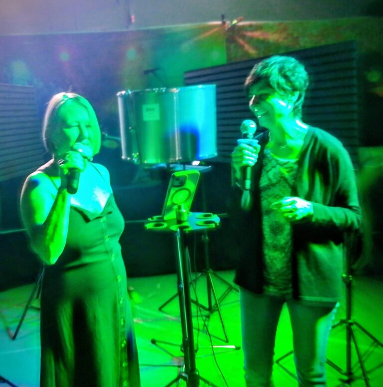 Two singers performing a live vocal session