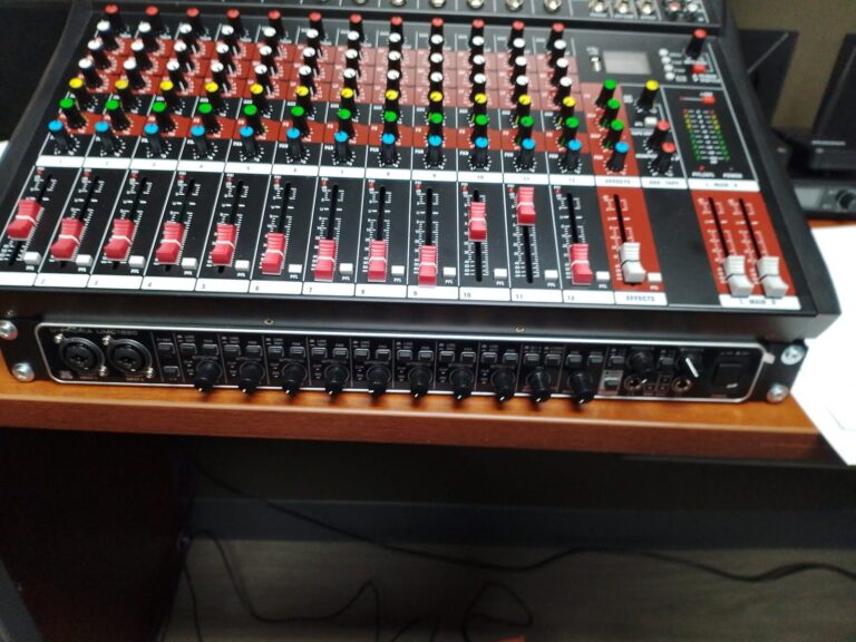 Multi-channel audio mixing console with colored channel knobs