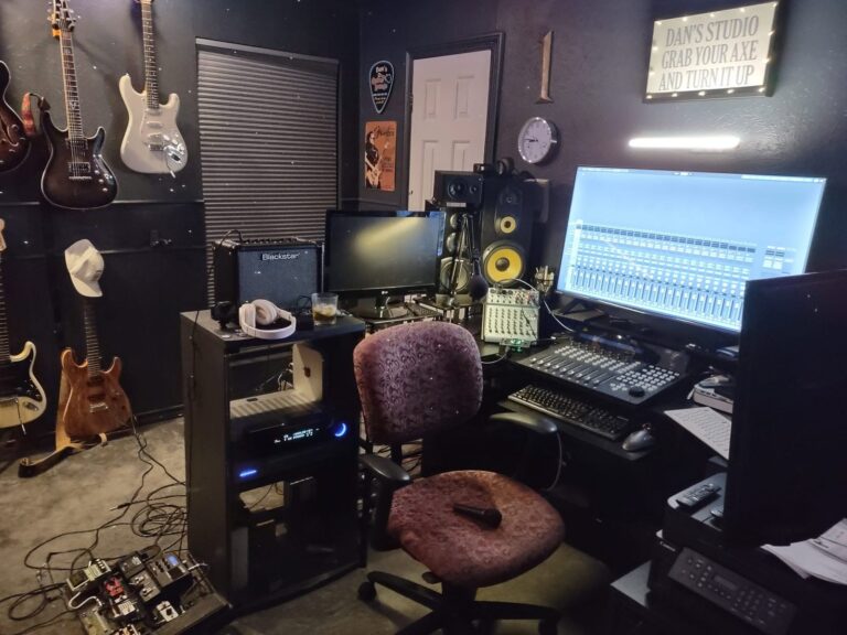 Mixing and recording suite with studio monitors, guitars and a DAW on screen