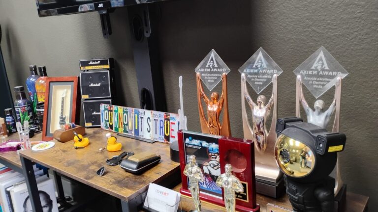Production desk with industry awards on display